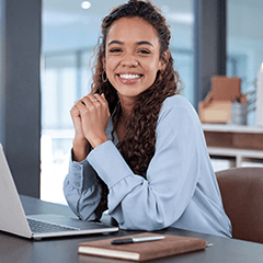 Woman smiling while working in office