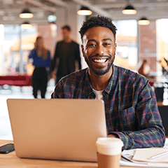 Man in office while working on laptop