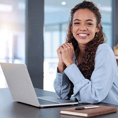 Woman smiling while working in office