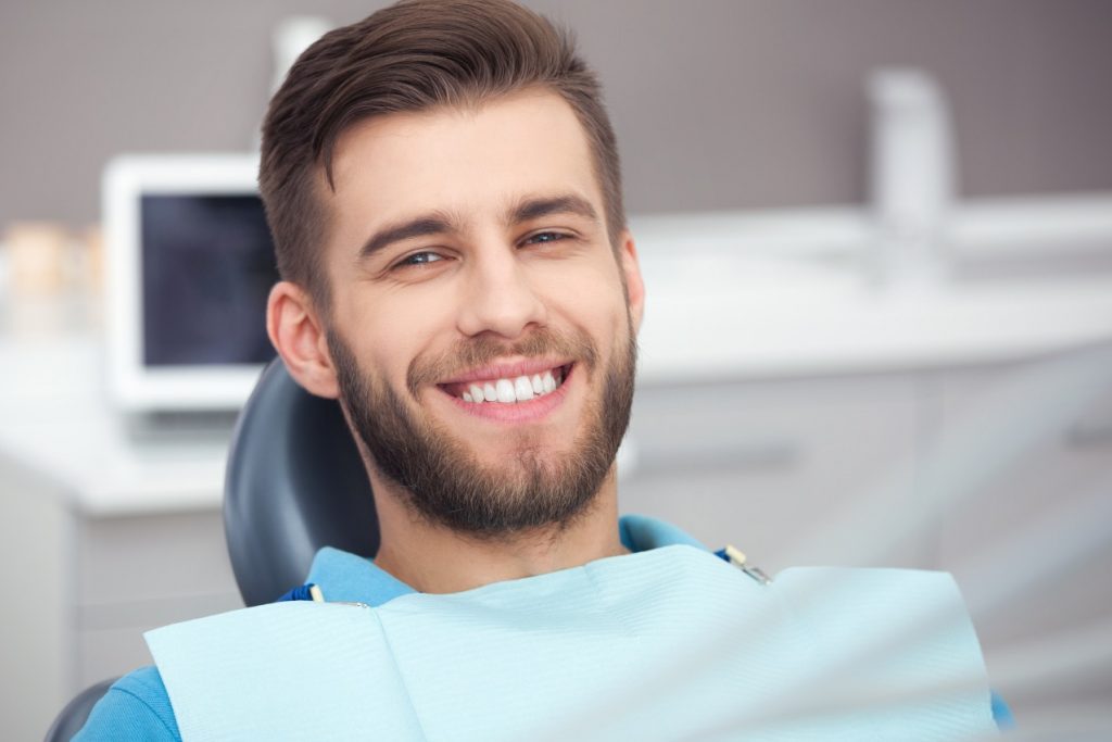 Man with brown hair having a consultation for dental implants 